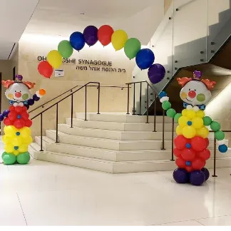 Purim-themed Balloon Arch with Clown Balloon Sculpture