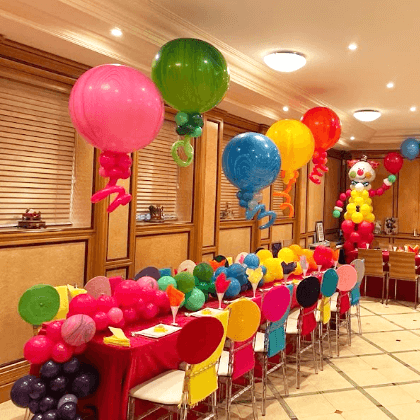 Rainbow helium balloon centerpiece and table runner