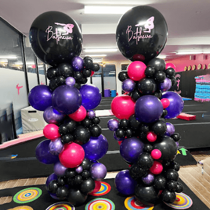 Purple, black, and pink organic balloon column