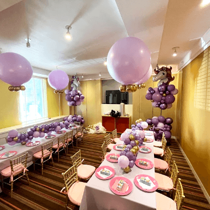 Purple and gold helium balloon centerpiece and table runner