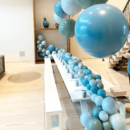 Teal helium balloon centerpiece and table runner