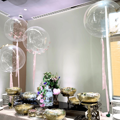 Clear balloon with ribbon centerpiece