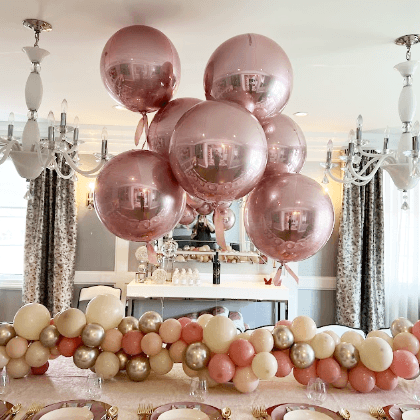 Rose gold helium balloon centerpiece and table runner