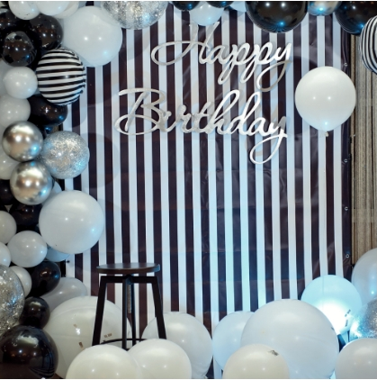 Black and white stripe birthday balloon decor inspo